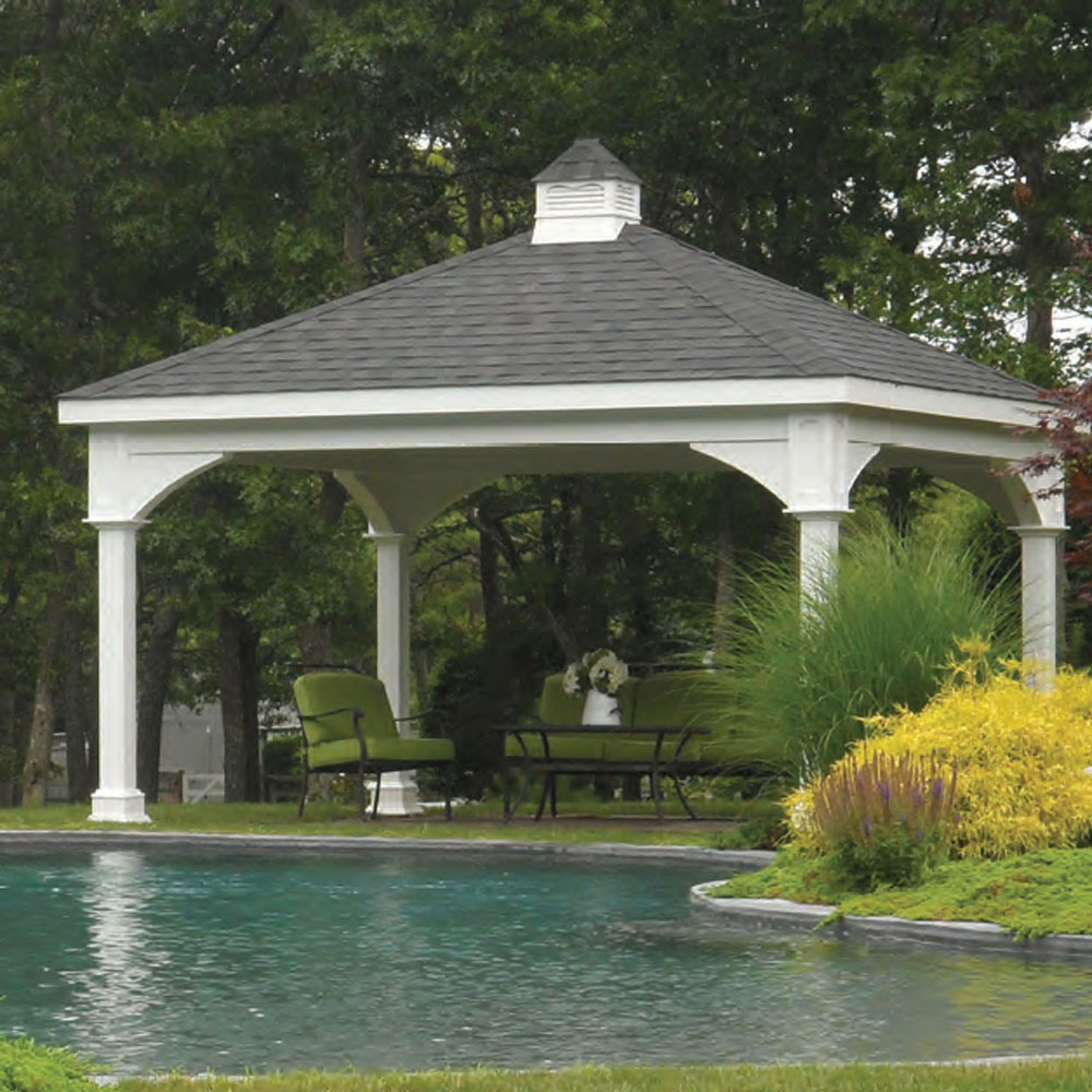 A pergola next to a lake. Clouds are overcast, making this a serene environment to relax.